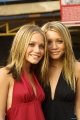 Olsen Twins with a very cute smiles on their faces 
