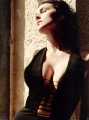 Monica Bellucci posing in hot black dress