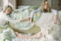 Olsen Twins are playing in bedding
